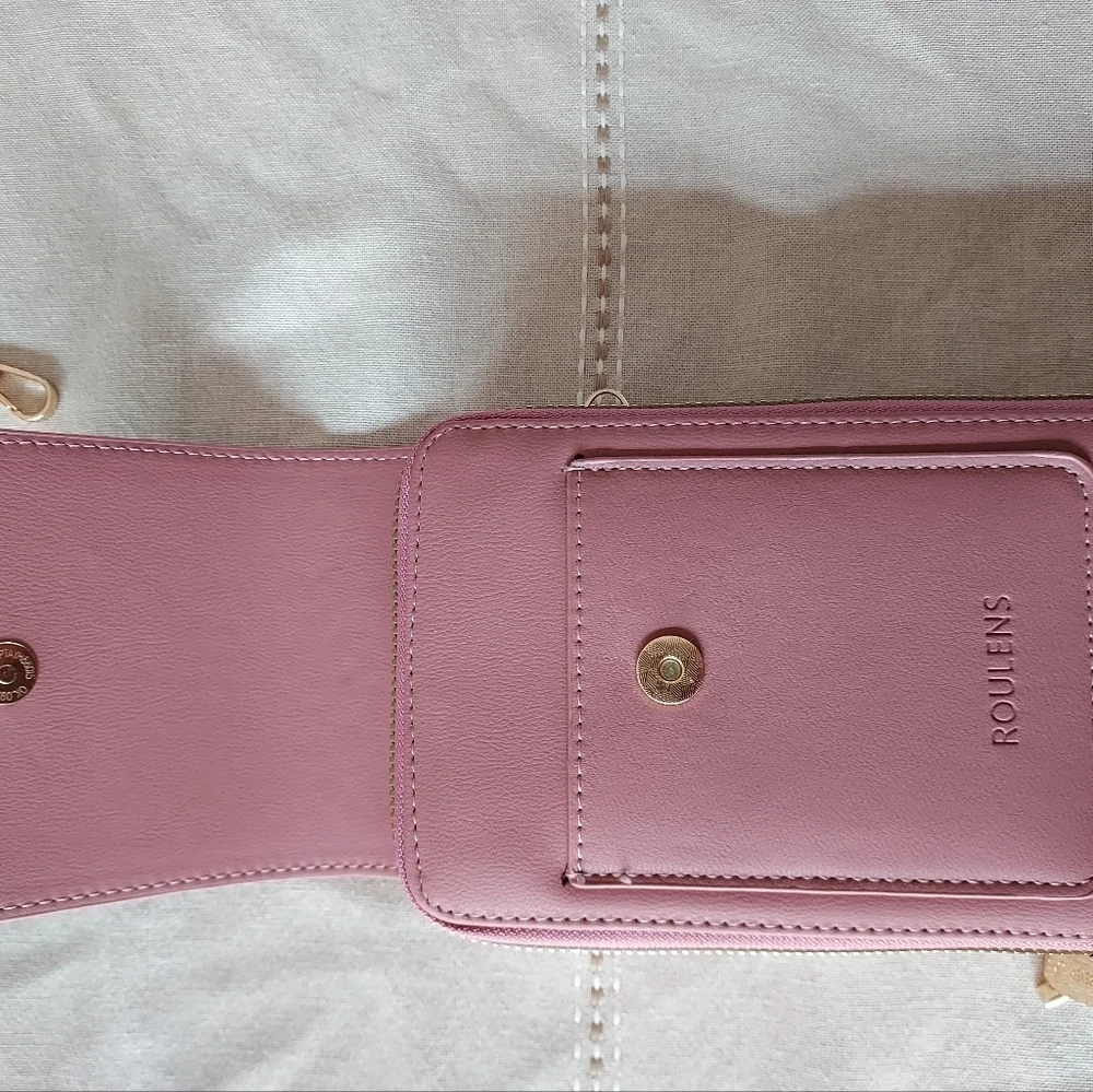 Roulens over shoulder or clutch wallet with cell phone holder.